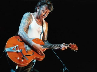 Brian Setzer, incapacitado para tocar la guitarra